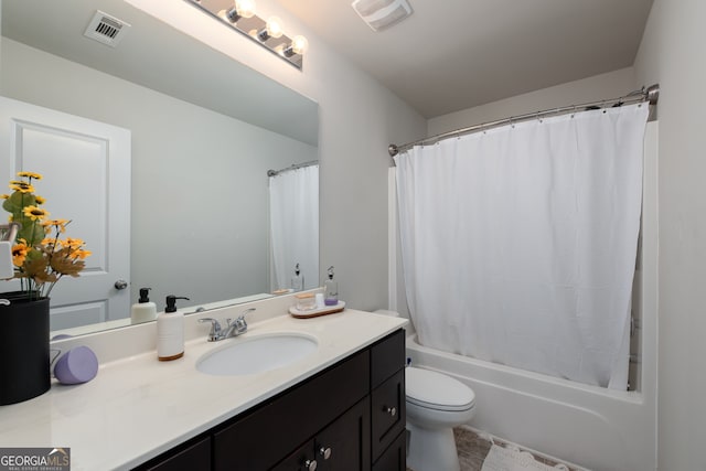 full bathroom featuring vanity, toilet, and shower / bath combination with curtain