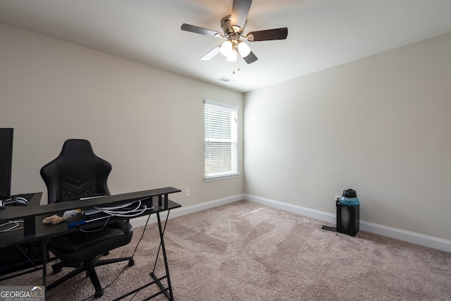 office space with ceiling fan and light colored carpet