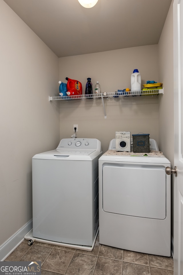 washroom with washing machine and dryer