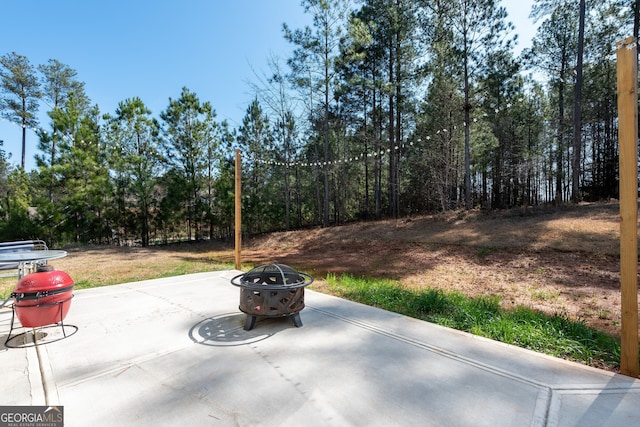 view of patio featuring a fire pit