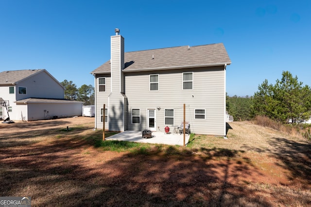 back of house featuring a patio