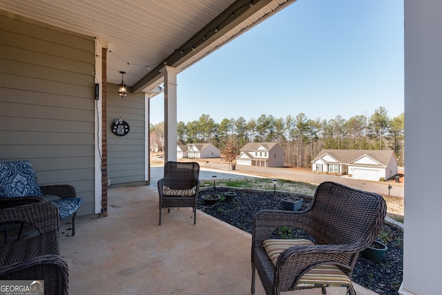 view of patio / terrace featuring a garage