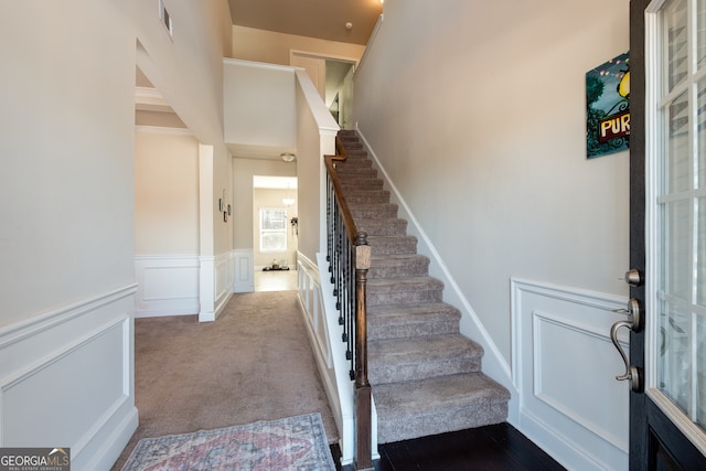 stairway with carpet floors