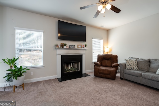 living room featuring ceiling fan and light carpet