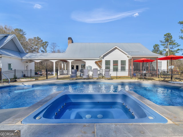 view of pool with a patio and an in ground hot tub