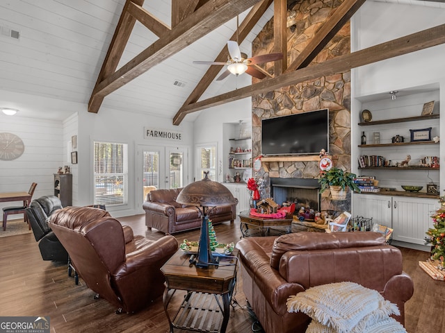 living room featuring a fireplace, dark wood-type flooring, high vaulted ceiling, and ceiling fan