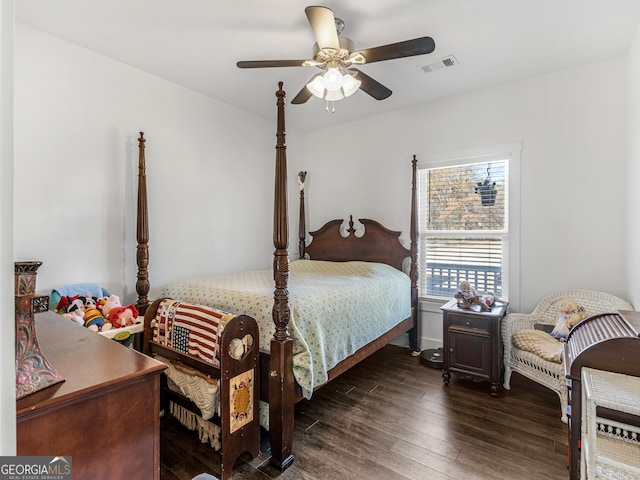 bedroom featuring ceiling fan and dark hardwood / wood-style flooring