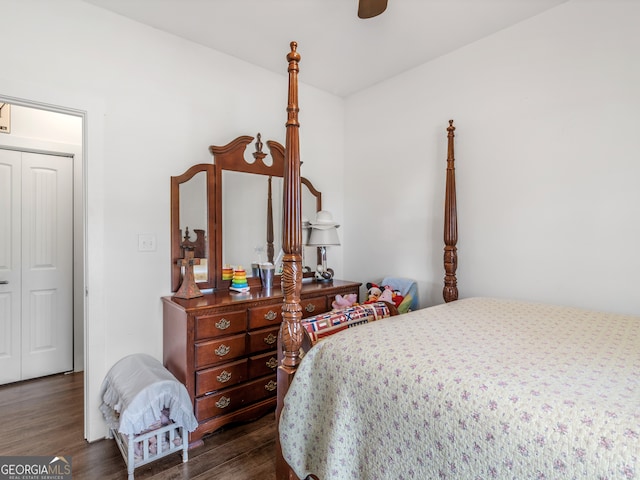 bedroom with a closet, ceiling fan, and dark hardwood / wood-style floors