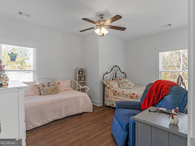 bedroom featuring ceiling fan and dark hardwood / wood-style flooring