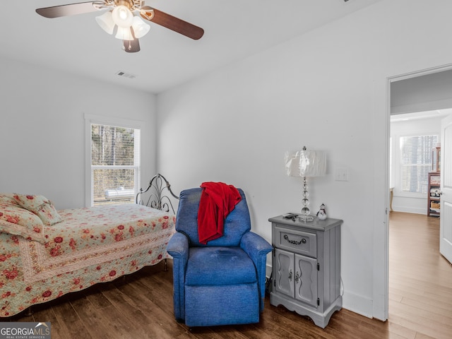 bedroom featuring dark wood-type flooring and ceiling fan