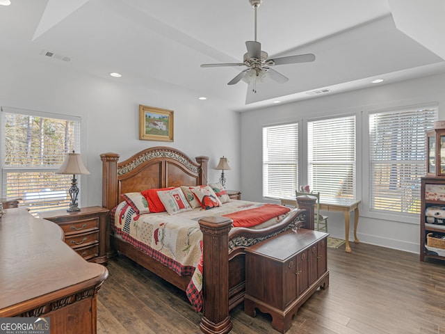 bedroom with ceiling fan and dark hardwood / wood-style floors