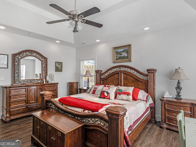 bedroom with ceiling fan and dark hardwood / wood-style floors