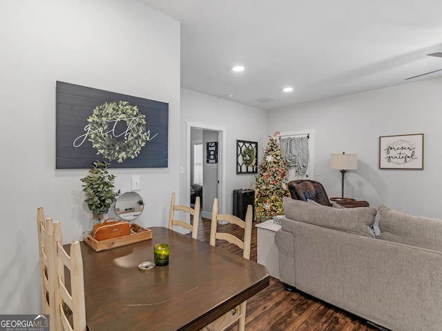 dining space with dark hardwood / wood-style floors