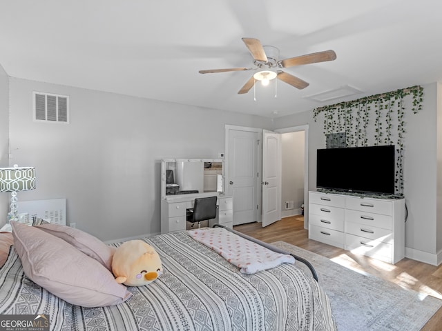 bedroom with light wood-type flooring and ceiling fan