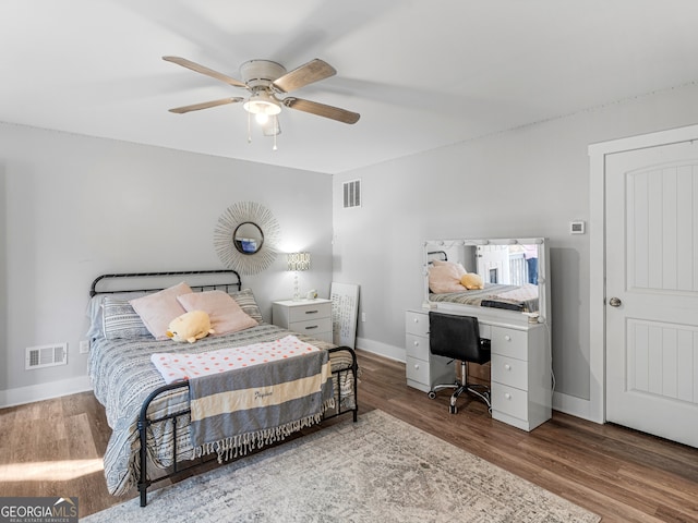 bedroom with ceiling fan and hardwood / wood-style flooring