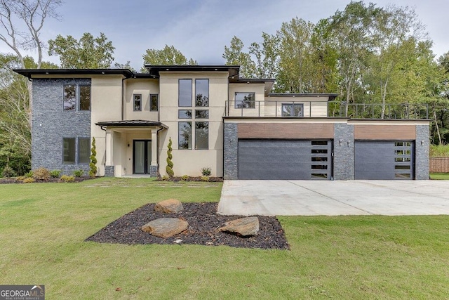 view of front of home with a front lawn and a balcony