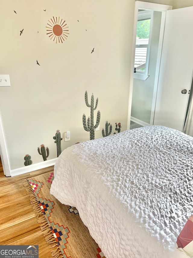 bedroom featuring hardwood / wood-style floors