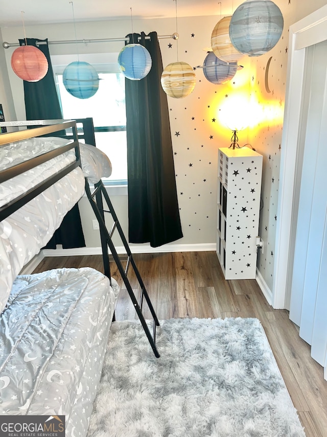 bedroom featuring wood-type flooring