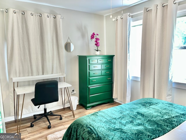 bedroom with light hardwood / wood-style flooring