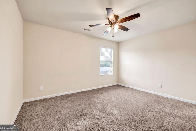 living room with ceiling fan and dark hardwood / wood-style flooring