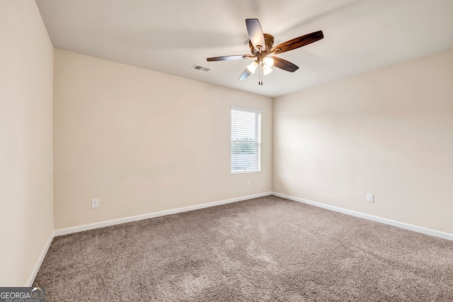 carpeted empty room with ceiling fan