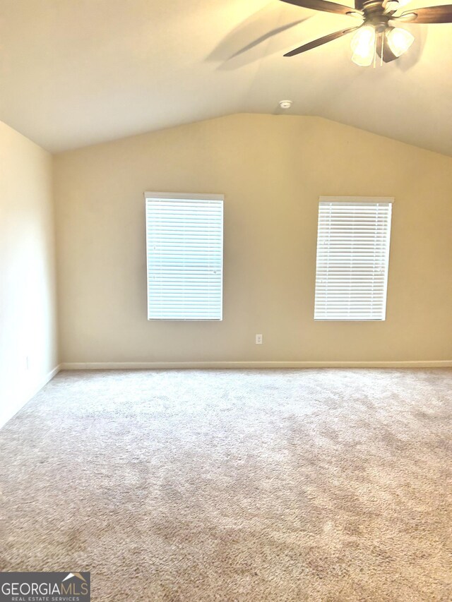 carpeted empty room featuring ceiling fan