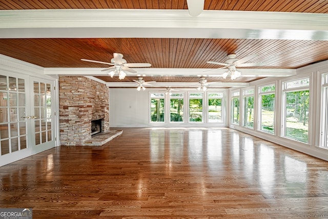 unfurnished living room featuring wooden ceiling and ceiling fan