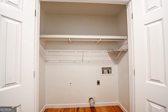 3060 Orchard Rd SW, Conyers, GA 30094 - washroom with electric dryer hookup, light wood-style flooring, and hookup for a washing machine