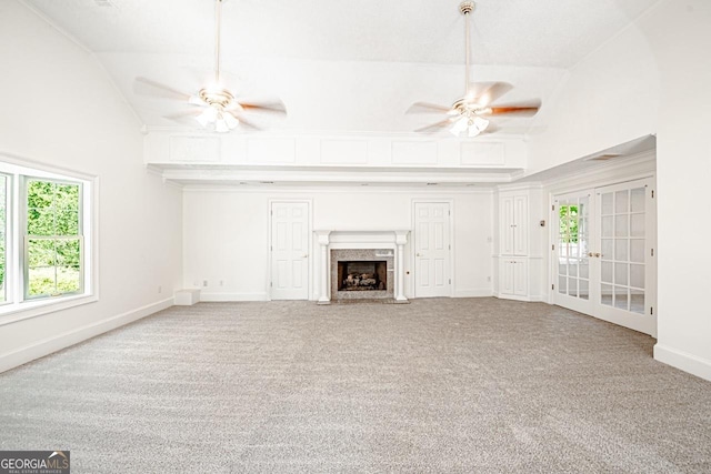 3060 Orchard Rd SW, Conyers, GA 30094 - unfurnished living room with ceiling fan, french doors, carpet floors, and high vaulted ceiling