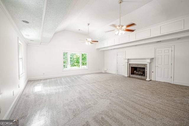 3060 Orchard Rd SW, Conyers, GA 30094 - unfurnished living room featuring carpet flooring, a ceiling fan, lofted ceiling, a premium fireplace, and a textured ceiling