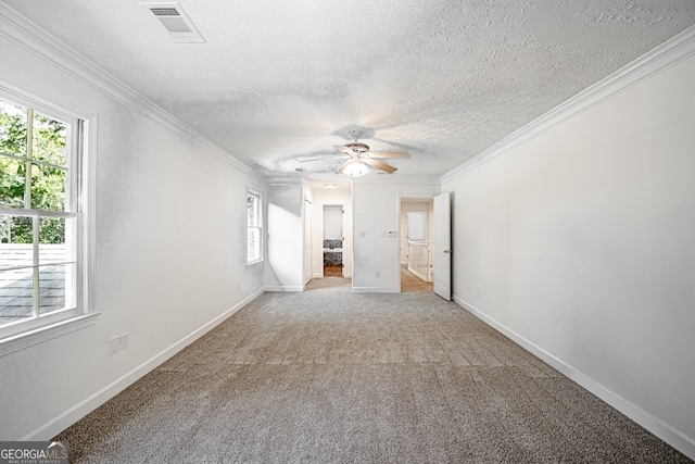 interior space with a textured ceiling, ornamental molding, and ceiling fan