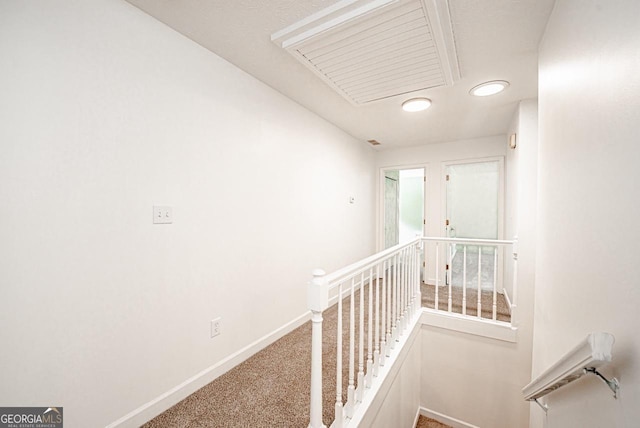 3060 Orchard Rd SW, Conyers, GA 30094 - hall featuring an upstairs landing, attic access, and carpet flooring