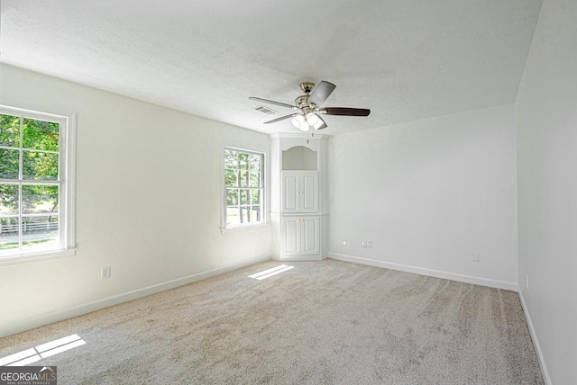 3060 Orchard Rd SW, Conyers, GA 30094 - empty room with plenty of natural light, carpet flooring, and ceiling fan