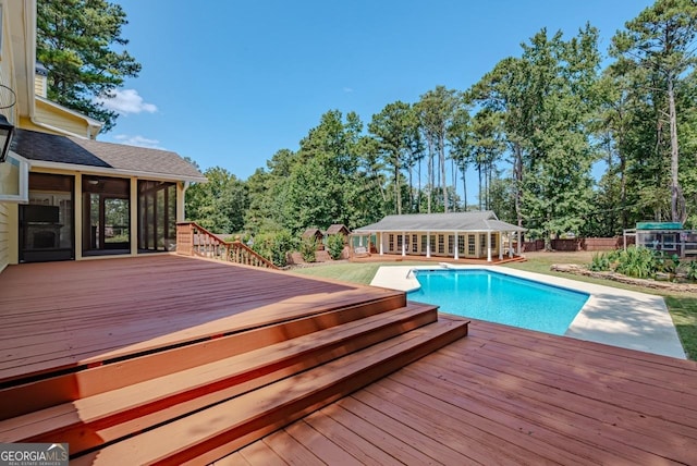 3060 Orchard Rd SW, Conyers, GA 30094 - swimming pool with a deck, a sunroom, an exterior structure, and an outbuilding