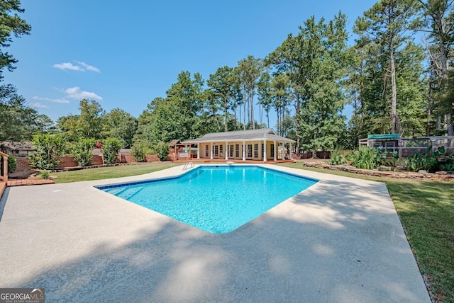 3060 Orchard Rd SW, Conyers, GA 30094 - outdoor pool with a storage structure, a patio area, an outbuilding, and view of scattered trees