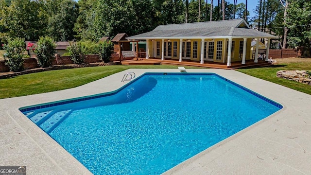 3060 Orchard Rd SW, Conyers, GA 30094 - view of pool with a storage structure, an outdoor structure, a wooden deck, view of scattered trees, and a patio area
