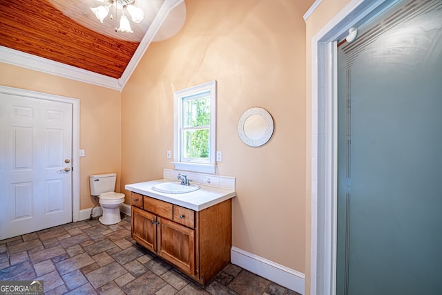 bathroom featuring crown molding, vanity, toilet, and vaulted ceiling