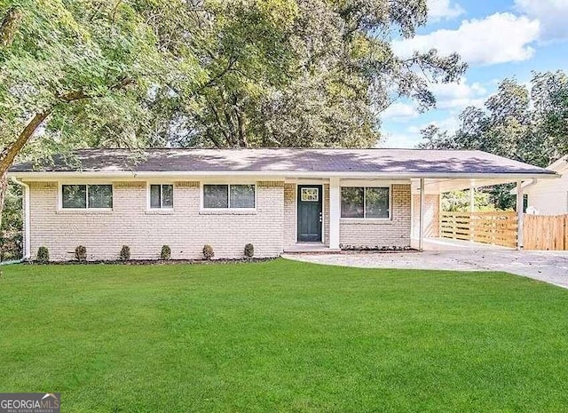 3188 Convair Ln, Decatur, GA 30032 - ranch-style home featuring fence, concrete driveway, an attached carport, brick siding, and a front yard