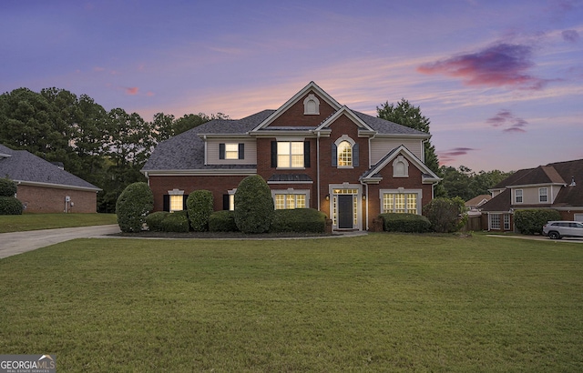 view of front of home with a yard