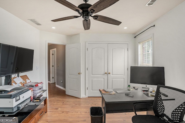 office space with ceiling fan and light wood-type flooring