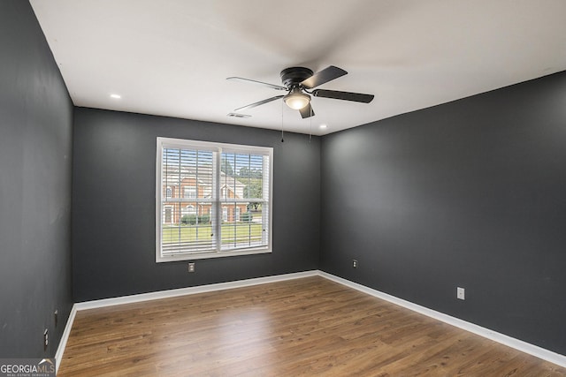 unfurnished room featuring hardwood / wood-style flooring and ceiling fan