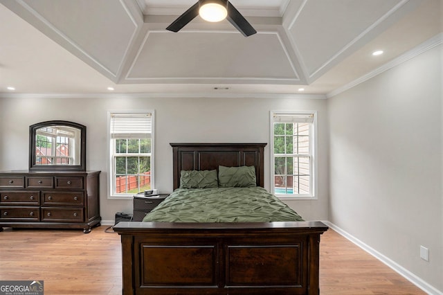 bedroom with ceiling fan, light hardwood / wood-style floors, and ornamental molding