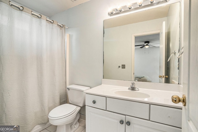 bathroom featuring vanity, tile patterned floors, ceiling fan, toilet, and walk in shower