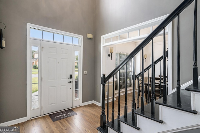 foyer entrance with hardwood / wood-style flooring