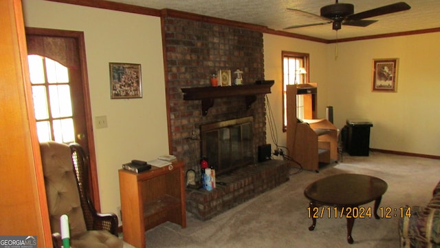 living room with ceiling fan, a fireplace, carpet floors, and a healthy amount of sunlight