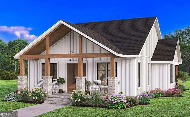 view of front of property with a porch and a front lawn