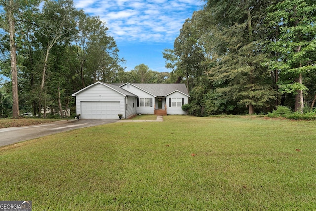 ranch-style house featuring a front lawn and a garage