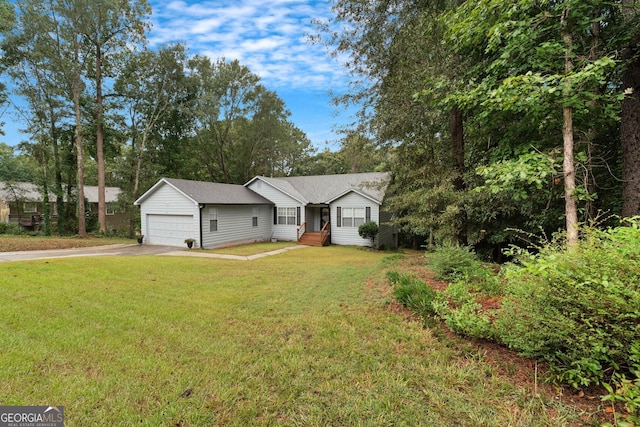 ranch-style house with a garage and a front yard