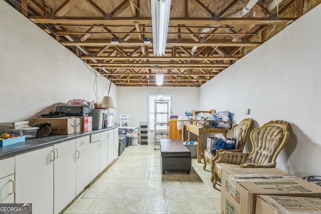 basement featuring light tile patterned floors