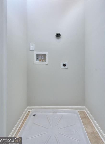 clothes washing area with washer hookup, light tile patterned floors, and electric dryer hookup